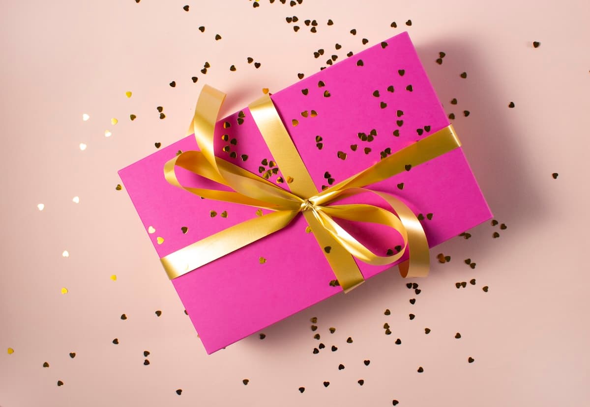 A beautifully wrapped gift box containing a styled menswear outfit